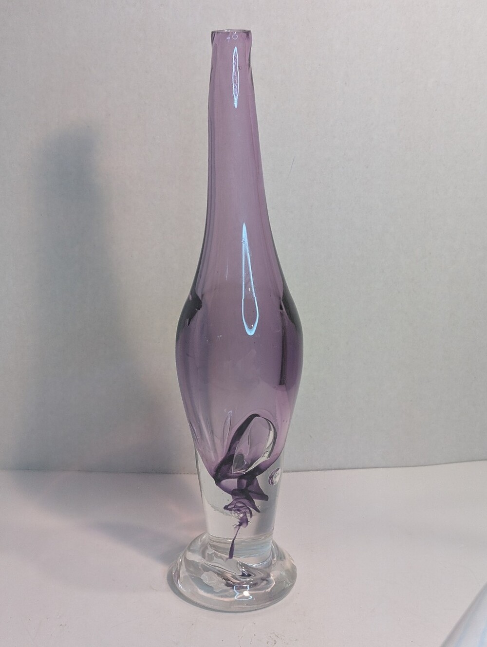Mid-Century Modern with a slender, elongated neck and a flared base.